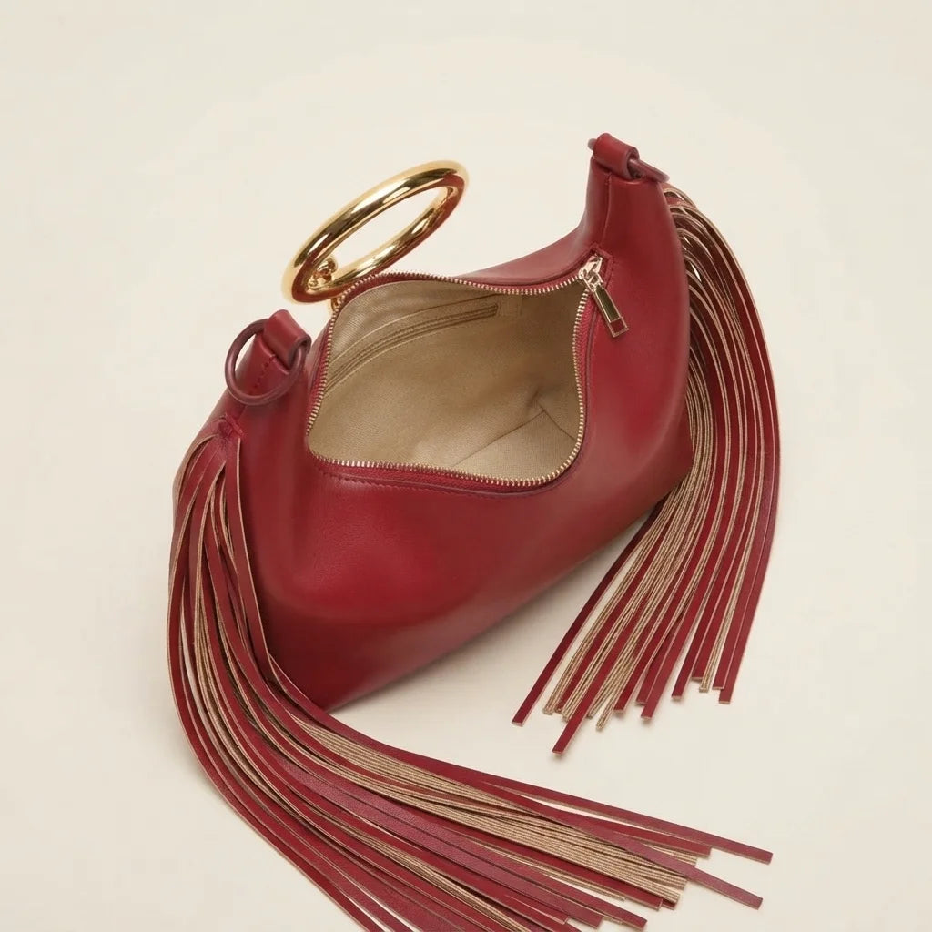 Interior lining and pockets of Burgundy red leather fringe hobo bag
