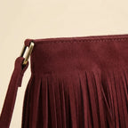 Close-up of fringe stitching and texture on Red red suede fringe bag