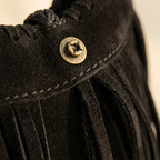 Close-up of fringe stitching and texture on Black side fringe hobo bag