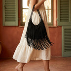 Woman wearing Black side fringe hobo bag with swaying fringe