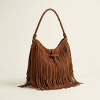 Brown side fringe hobo bag, three-quarter angle showing side depth
