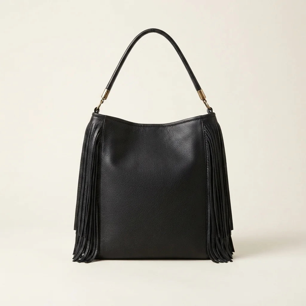 Back panel of Black slouchy fringe bag with strap attachments