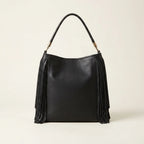 Back panel of Black slouchy fringe bag with strap attachments