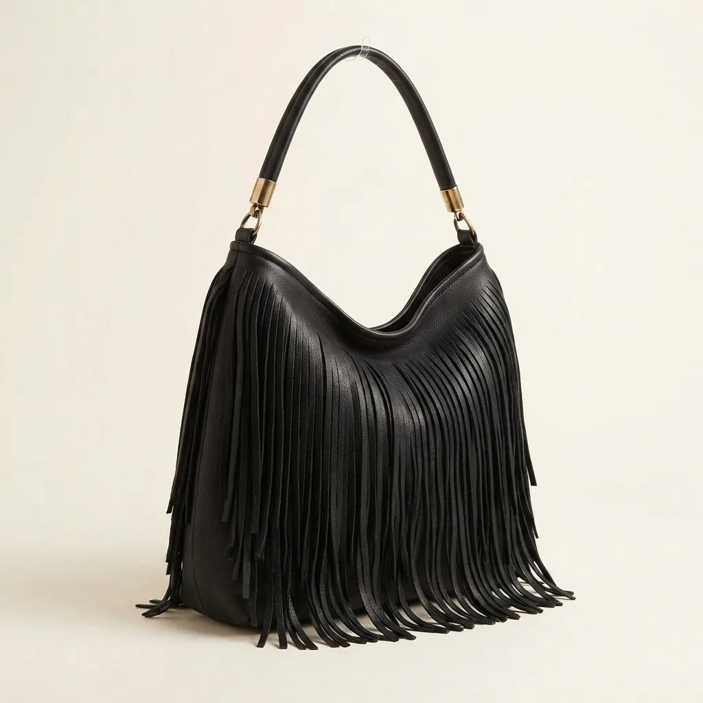 Black slouchy fringe bag, three-quarter angle showing side depth