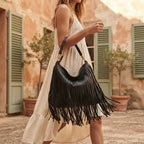 Woman wearing Black slouchy fringe bag with swaying fringe