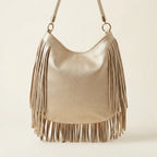 Back panel of Gold slouchy fringe bag with strap attachments