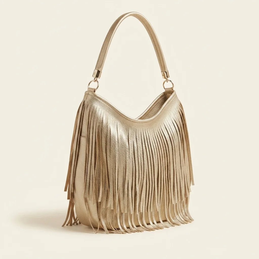 Gold slouchy fringe bag, three-quarter angle showing side depth