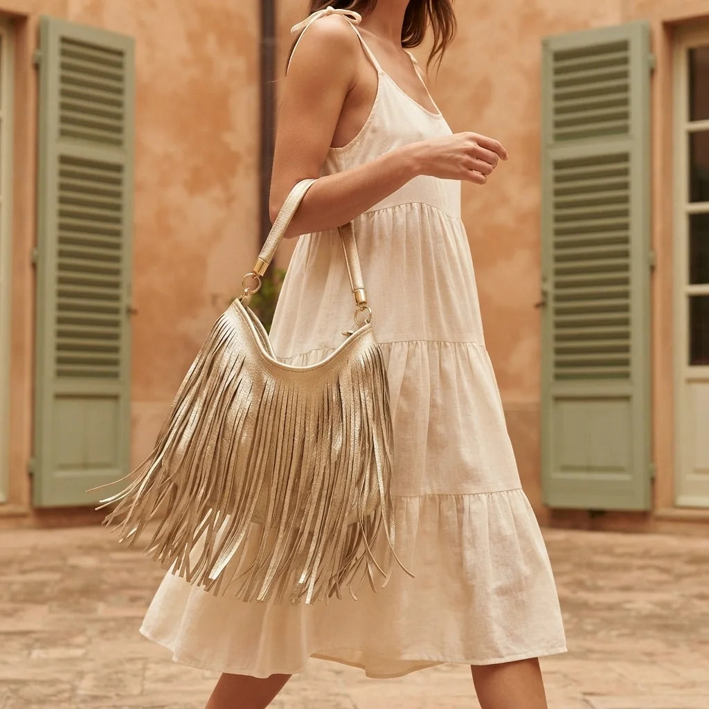 Woman wearing Gold slouchy fringe bag with swaying fringe
