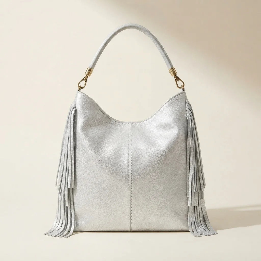 Back panel of Silver slouchy fringe bag with strap attachments