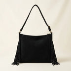 Back panel of Black small black fringe bag with strap attachments