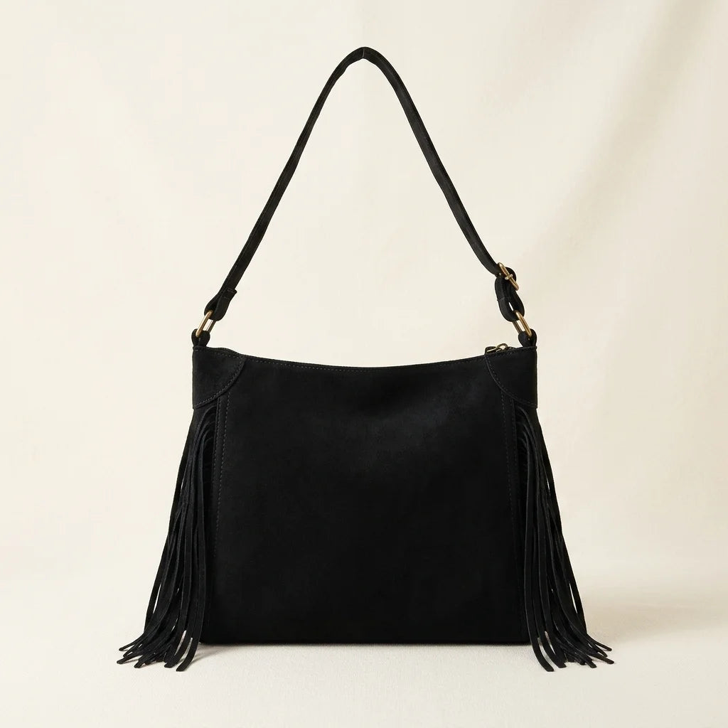 Back panel of Black small black fringe bag with strap attachments