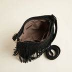 Interior lining and pockets of Black small black fringe bag
