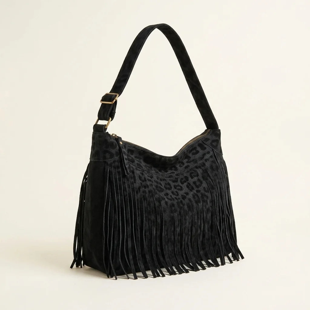 Black small black fringe bag, three-quarter angle showing side depth