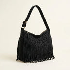 Black small black fringe bag, three-quarter angle showing side depth