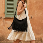 Woman wearing Black small black fringe bag with swaying fringe
