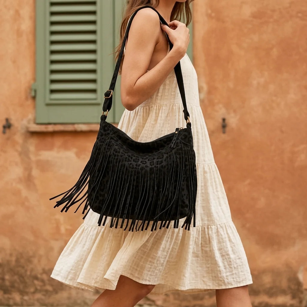 Woman wearing Black small black fringe bag with swaying fringe