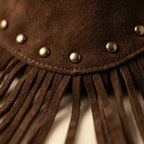 Close-up of fringe stitching and texture on Brown small brown fringe bag