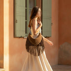 Woman wearing Brown small brown fringe bag with swaying fringe