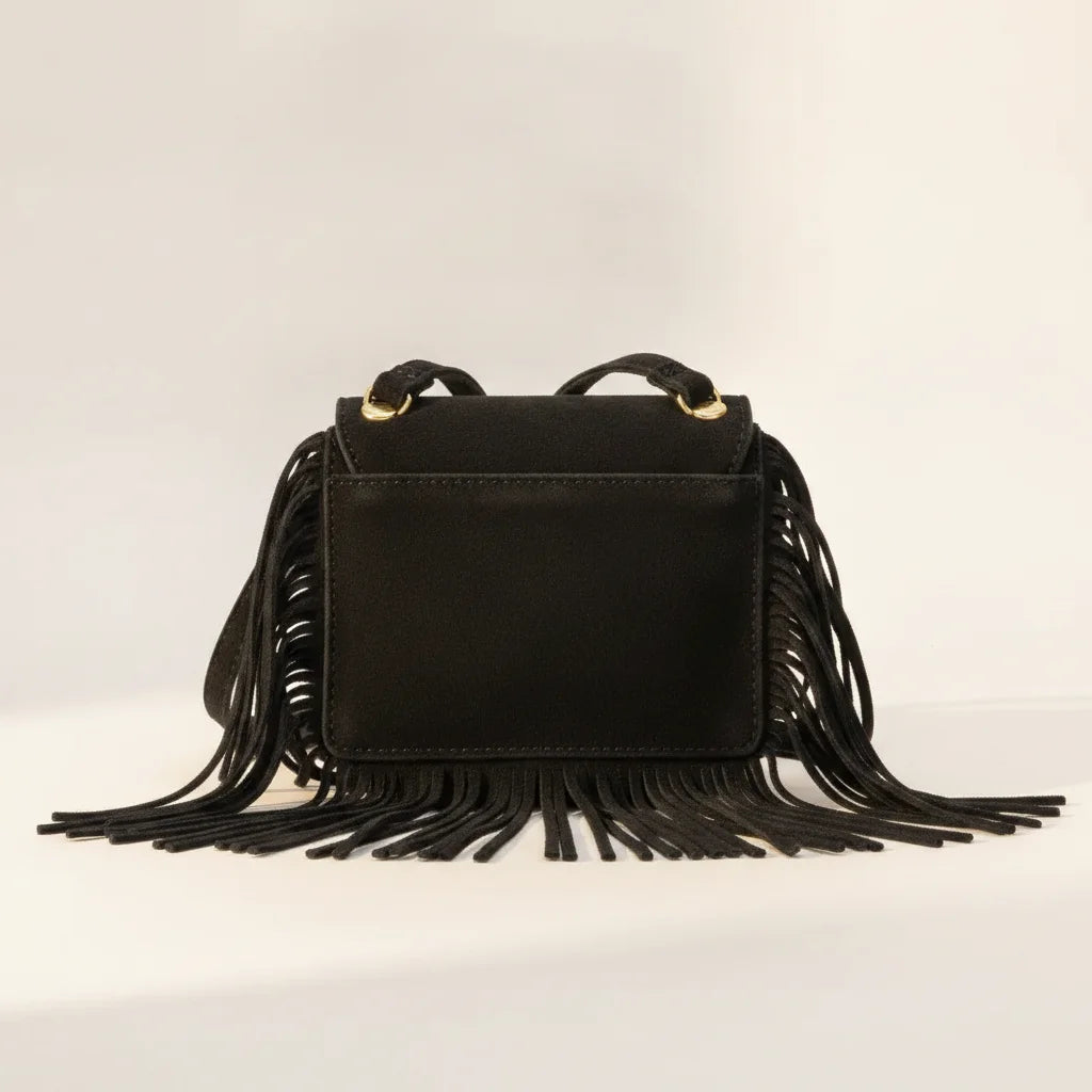 Back panel of Black small fringe bag with strap attachments