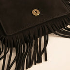 Close-up of fringe stitching and texture on Black small fringe bag