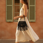 Woman wearing Black small fringe bag with swaying fringe