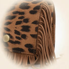 Close-up of fringe stitching and texture on Leopard small fringe bag