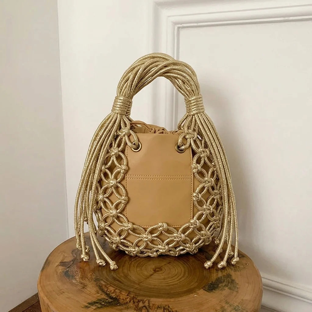 Back panel of Gold small fringe bucket bag with strap attachments