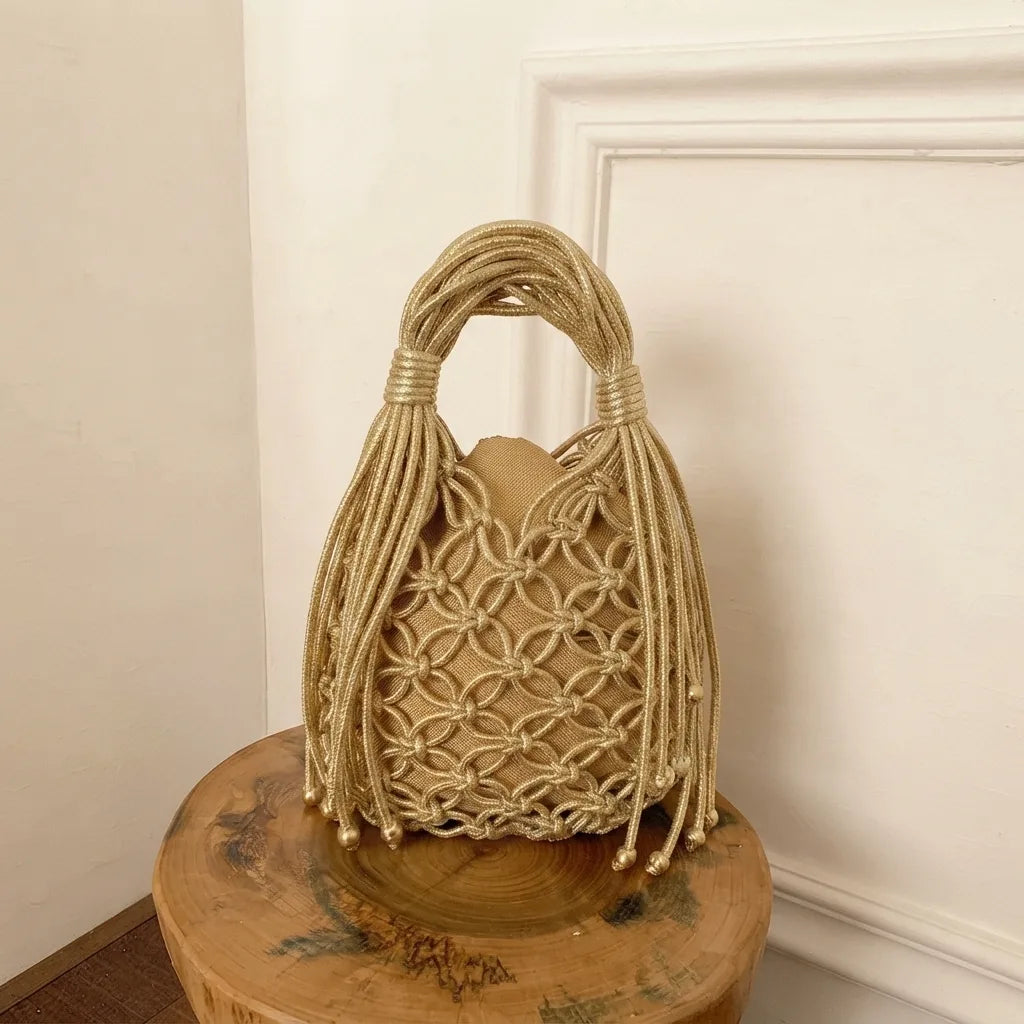Gold small fringe bucket bag, front view