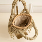 Interior lining and pockets of Gold small fringe bucket bag