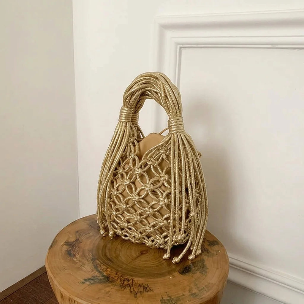 Gold small fringe bucket bag, three-quarter angle showing side depth