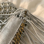 Close-up of fringe stitching and texture on Silver small fringe bucket bag