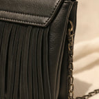 Close-up of fringe stitching and texture on Black small fringe crossbody bag