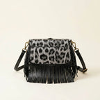 Back panel of Grey small fringe leather crossbody bag with strap attachments