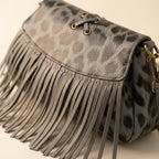 Close-up of fringe stitching and texture on Grey small fringe leather crossbody bag