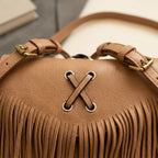 Close-up of fringe stitching and texture on Light Brown small fringe leather crossbody bag