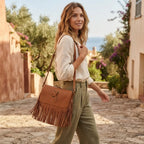 Woman wearing Light Brown small fringe leather crossbody bag with swaying fringe