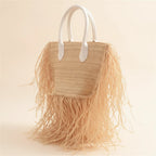 Natural small fringe tote bag, three-quarter angle showing side depth