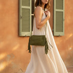Woman wearing Khaki small suede fringe bag with swaying fringe