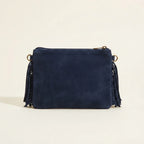 Back panel of Navy small suede fringe bag with strap attachments
