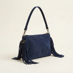 Navy small suede fringe bag, three-quarter angle showing side depth