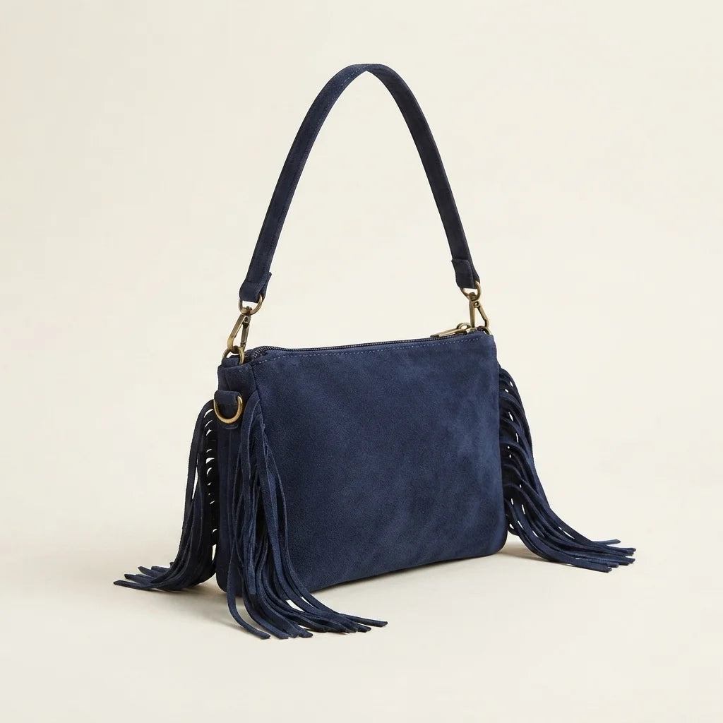 Navy small suede fringe bag, three-quarter angle showing side depth