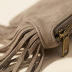 Close-up of fringe stitching and texture on Taupe small suede fringe bag