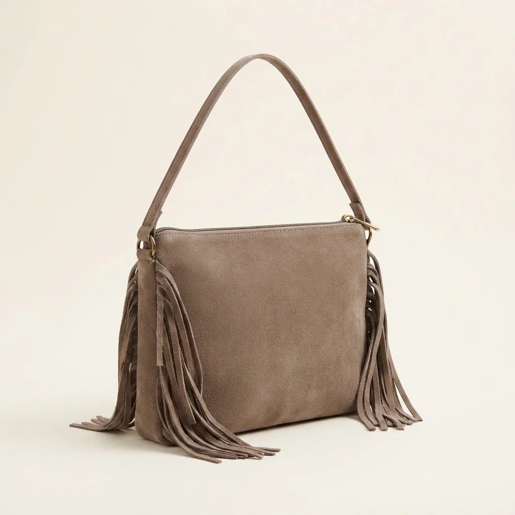 Taupe small suede fringe bag, three-quarter angle showing side depth