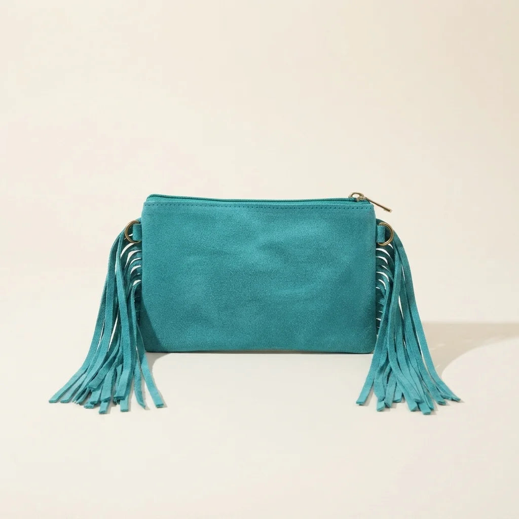 Back panel of Turquoise small suede fringe bag with strap attachments