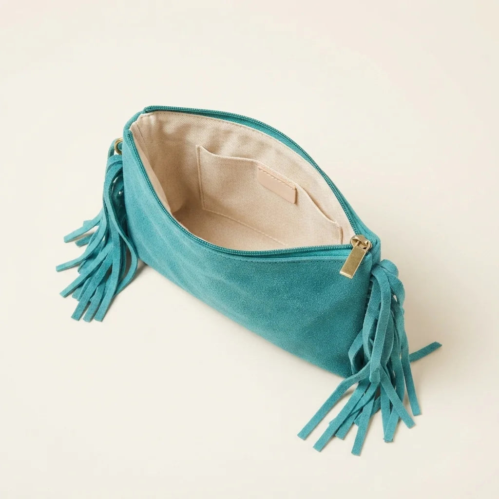 Interior lining and pockets of Turquoise small suede fringe bag