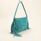 Turquoise small suede fringe bag, three-quarter angle showing side depth