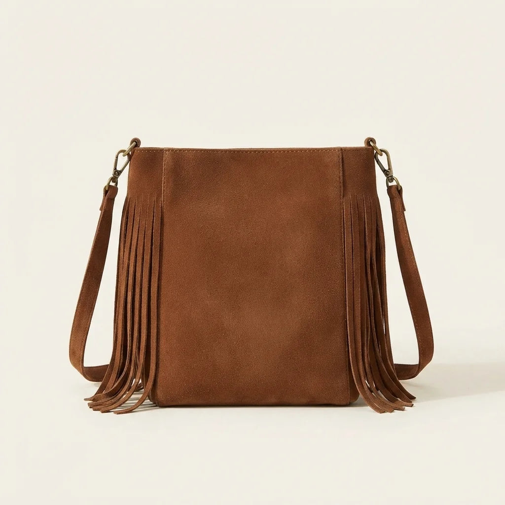 Back panel of Brown small tan fringe bag with strap attachments