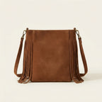 Back panel of Brown small tan fringe bag with strap attachments