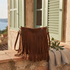 Brown small tan fringe bag styled in a warm Mediterranean setting