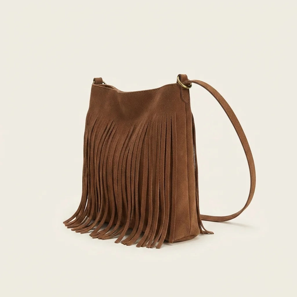 Brown small tan fringe bag, three-quarter angle showing side depth